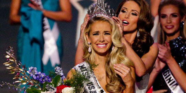 Miss Oklahoma Olivia Jordan is crowned Miss USA by Miss USA 2014 Nia Sanchez during the 2015 Miss USA pageant in Baton Rouge, La., Sunday, July 12, 2015. (AP Photo/Derick E. Hingle)