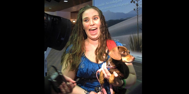 Jan. 30, 2013: Mandi Smith, of Fort Campbell, Ky., is reunited with her dog, Pooka at the Albuquerque International Sunport Airport in Albuquerque, N.M.