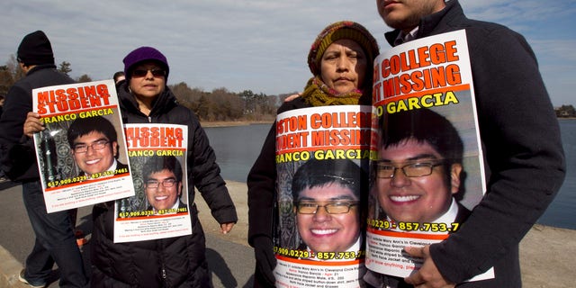 Feb. 27, 2012: Luzmila Garcia, of Newton, Mass., center right, mother of missing Boston College student Franco Garcia, displays a placard of her son along with Franco's aunt Carmen Espinoza, left, and his cousin Pablo Marchena, right, at the Chestnut Hill Reservoir where Mass. state police are searching the water for the missing student, in Boston. Garcia, 21, has not been seen since early Wednesday, at a bar popular with Boston College students near campus.