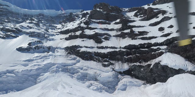 May 31, 2014: This photo provided by the National Parks Service, shows the Liberty Ridge Area of Mount Rainier as viewed from the Carbon Glacier. (AP Photo/National Park Service)