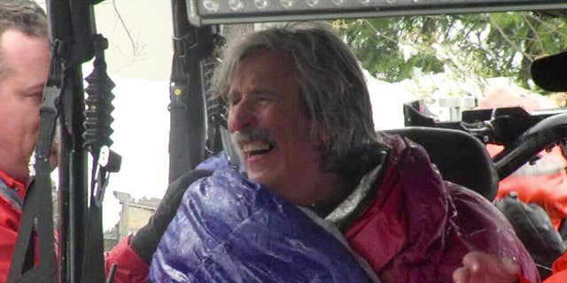 This image from video provided by KTXL Fox 40 Sacramento, shows trail runner Robert Root after being rescued Tuesday, April 1, 2014, near Foresthill, Calif., in Placer County. Root was found alive in snowy conditions, two days after he went missing near a trail in a mountainous region of Northern California, authorities said. Root, 55, of Modesto, Calif., was wearing only a light running shirt, shorts and running shoes when he was discovered by rescuers on the Western States trail. (AP Photo/KTXL Fox 40 Sacramento)