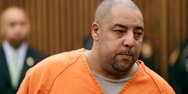 Elias Acevedo stands before a judge during his arraignment Monday, Oct. 21, 2013, in Cleveland.