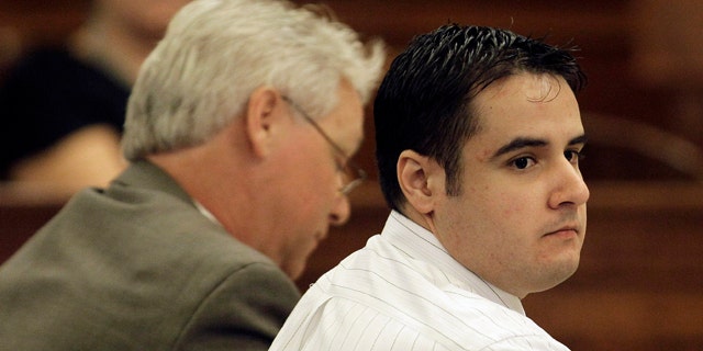 Aug. 13, 2010: Former Marine Cesar Laurean, right, listens during his trial at the Wayne County Courthouse in Goldsboro, N.C.