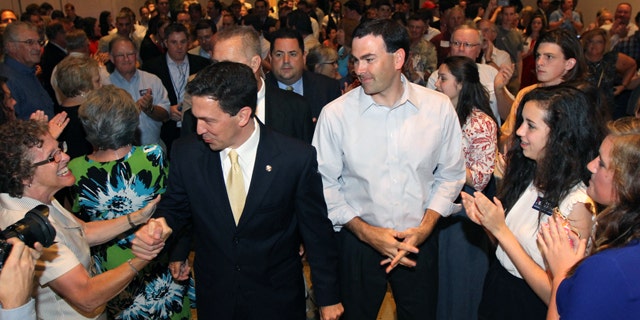 June 3, 2014: Chris McDaniel greets supporters as he heads to the podium to speak about his close race with incumbent U.S. Senator Thad Cochran during McDaniel's election night party at the Lake Terrace Convention Center in Hattiesburg, Miss. (AP Photo/George Clark)