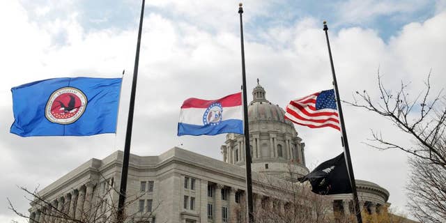 Flags around the Missouri Capitol complex in Jefferson City were lowered to half staff Thursday, Feb. 26, 2015, after the death of State Auditor Tom Schweich, who died Thursday morning. Police in suburban St. Louis are calling the death of Schweich an "apparent suicide." (AP Photo/The Jefferson City News-Tribune, Julie Smith)