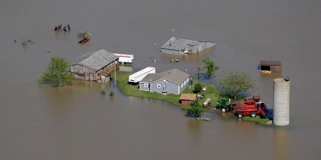 May 3: A farm is seen surrounded by floodwater near New Madrid, Mo.