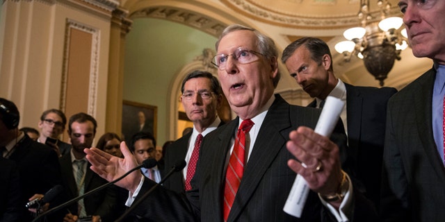 Senate Majority Leader Mitch McConnell of Ky., joined by, from left, Sen. John Barrasso, R-Wyo., Sen. John Thune, R-S.D., and Senate Majority Whip John Cornyn of Texas, faces reporters' questions on controversial statements by Republican presidential candidate Donald Trump, Tuesday, June 7, 2016, during a news conference on Capitol Hill in Washington following a closed-door policy meeting. McConnell called on his party's presumptive nominee to quit scrapping with various minority groups and "get on message" in order to win the White House. (AP Photo/J. Scott Applewhite)