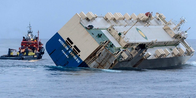 The car carrier Modern Express, seen here listing badly as it is being towed off the French coast, is not slated for demolition - yet.