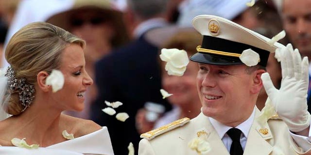 July 2, 2011: In this file photo, Prince Albert II of Monaco and Princess Charlene of Monaco depart from the Monaco palace after their religious wedding ceremony. (AP)