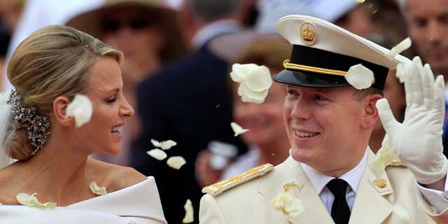 July 2, 2011: In this file photo, Prince Albert II of Monaco and Princess Charlene of Monaco depart from the Monaco palace after their religious wedding ceremony. (AP)