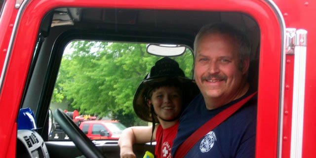 June 19, 2014: This image provided by Gallitan County Fire Department shows Chief Todd Rummel, who was killed in an accident Thursday after a fire engine and a pickup truck collided on a Montana highway, with an unidentified passenger (AP Photo/Gallitan County Fire Department)