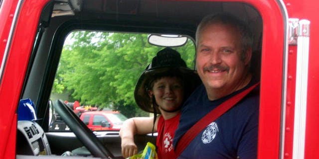 June 19, 2014: This image provided by Gallitan County Fire Department shows Chief Todd Rummel, who was killed in an accident Thursday after a fire engine and a pickup truck collided on a Montana highway, with an unidentified passenger (AP Photo/Gallitan County Fire Department)