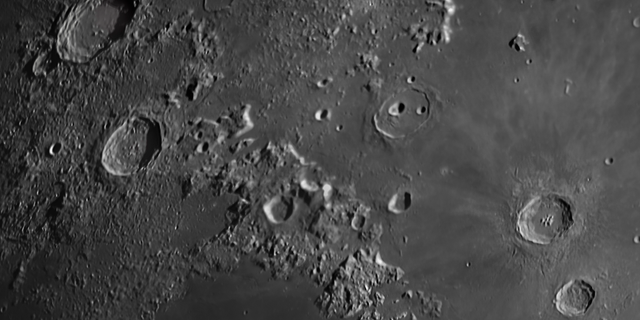 A lunar landscape scene captured from the Cumeada Observatory in Portugal's Dark Sky Alqueva Reserve shows the impact craters of Aristoteles, Eudoxus, Aristillus and Autolycus.
