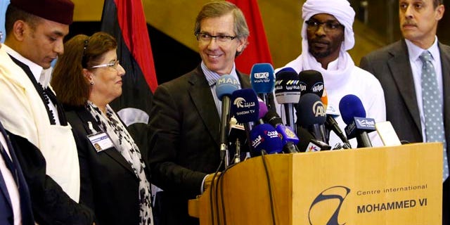 Oct. 8, 2015: United Nations envoy for Libya Bernardino Leon, center, makes an announcement to the media in Skhirat, Morocco. Leon proposed a national unity government for Libya after months of difficult talks between the north African country's two rival governments, but now it's up to the two sides and Libyans themselves to approve it. (AP Photo/Abdeljalil Bounhar)