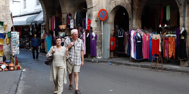 Oct. 7, 2012: Tourists stroll through Casablanca, Morocco's Habous district, built by the French in the 1920s to resemble a traditional Moroccan medina.