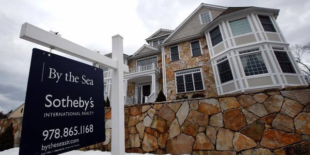 This March 21, 2014 photo shows a home for sale in North Andover, Mass. Freddie Mac, the mortgage company, releases weekly mortgage rates on Thursday, April 24, 2014. (AP Photo/Elise Amendola)