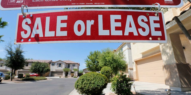FILE -- July 30, 2013: A home is seen for sale in Gilbert, Ariz.