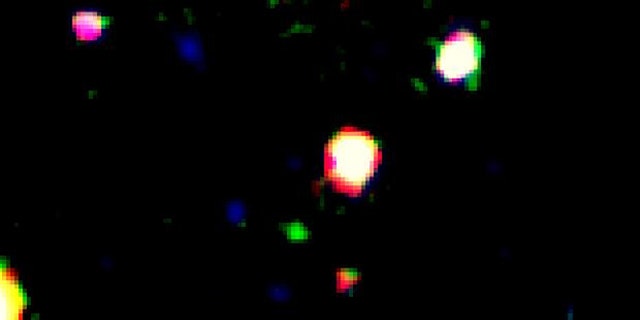 False color image of the galaxy LAEJ095950.99+021219.1, which appears as the green source near the center of the image.