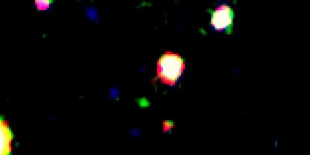 False color image of the galaxy LAEJ095950.99+021219.1, which appears as the green source near the center of the image.