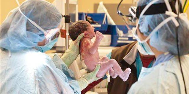A newborn baby is shown.