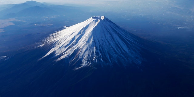 File photo - Japan's Mount Fuji is seen covered with snow from an airplane December 5, 2013.
