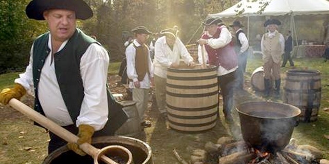 Master distillers at Mount Vernon's Gristmill and Distillery
