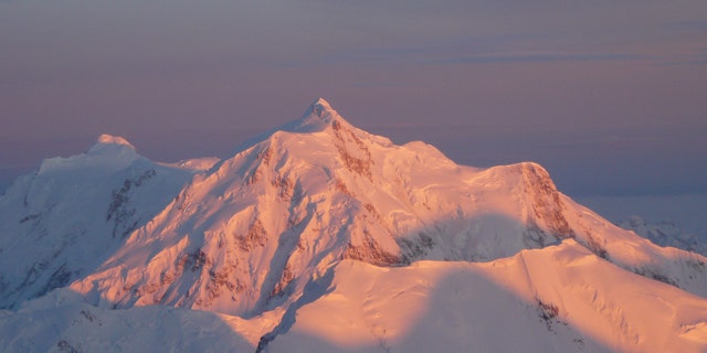 Beautiful but deadly? Light escapes through a break in the clouds over Mt. Hunter in Denali National Park.