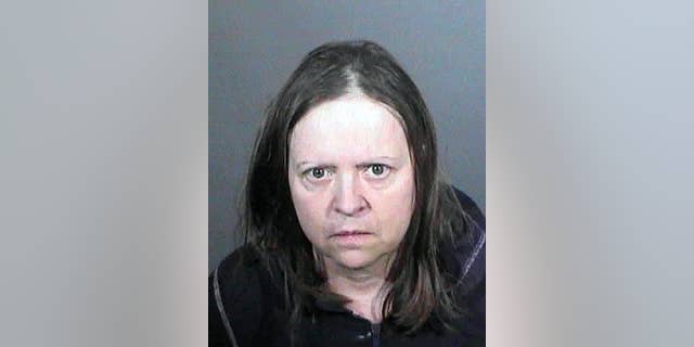 This undated law enforcement booking photo from the Los Angeles County Sheriff's Office shows Cathryn Parker. Parker accused of stealing the identities of people working behind the scenes in Hollywood film production has lived under at least 74 aliases, Los Angeles County sheriff's officials said. As of Friday, April 17, 2015, Parker was in federal custody in Northern California, where she was wanted for probation violations. (Los Angeles County Sheriff's Office via AP)