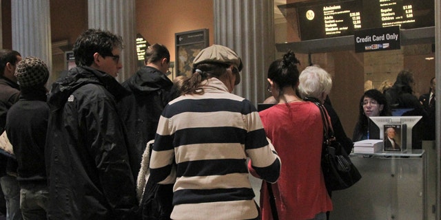 March 19, 2013: Visitors to the Metropolitan Museum of Art in New York wait in line to buy admission tickets.