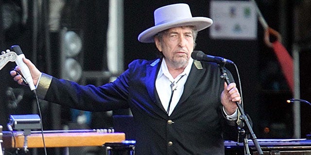 FILE - This July 22, 2012 file photo shows U.S. singer-songwriter Bob Dylan performing on at "Les Vieilles Charrues" Festival in Carhaix, western France. (AP Photo)