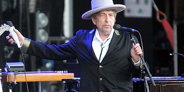 FILE - This July 22, 2012 file photo shows U.S. singer-songwriter Bob Dylan performing on at "Les Vieilles Charrues" Festival in Carhaix, western France. (AP Photo)