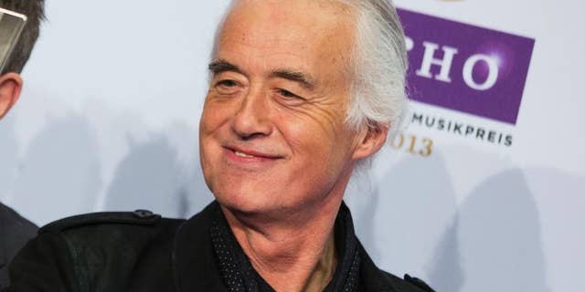 FILE - This March 21, 2013 file photo shows Jimmy Page, of Led Zeppelin, during the German Echo music award ceremony in Berlin, Germany. Page has remastered the band’s entire catalog. After spending the past couple of years listening to hundreds of hours of the band’s music, nine freshly mastered studio albums will be released in chronological order, three at a time. The first set arrives Tuesday, June 3. (AP Photo/Gero Breloer, File)