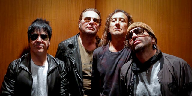 Members of the Mexican rock band ManÃÂ pose during an interview in New York.