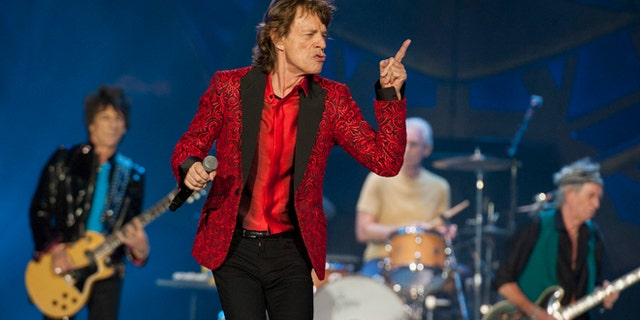 FILE - In this July 4, 2015 file photo, Ronnie Wood, Mick Jagger, Charlie Watts and Keith Richards of the Rolling Stones perform at the Indianapolis Motor Speedway  in Indianapolis. On Thursday, Nov. 5, 2015,  the band announced âThe America Latina OlÃ©â tour, which will kick off Feb. 3 in Santiago, Chile. (Photo by Barry Brecheisen/Invision/AP)