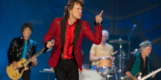 FILE - In this July 4, 2015 file photo, Ronnie Wood, Mick Jagger, Charlie Watts and Keith Richards of the Rolling Stones perform at the Indianapolis Motor Speedway in Indianapolis. On Thursday, Nov. 5, 2015, the band announced âThe America Latina Oléâ tour, which will kick off Feb. 3 in Santiago, Chile. (Photo by Barry Brecheisen/Invision/AP)