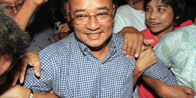 Myanmar's comedian and activist Zarganar, who was serving a 35-year sentence in Myitkyina prison in northernmost Kachin State, arrives at Yangon International Airport in Yangon, Myanmar, after he was released Wednesday, Oct. 12, 2011.