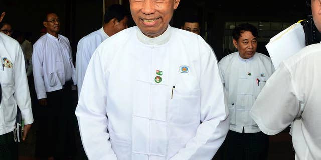 In this Wednesday, Aug 12, 2015, photo, Myanmar's Parliament speaker Shwe Mann leaves after a press conference at the Union Solidarity and Development Party headquarters in Naypyitaw, Myanmar. Security forces have seized control of the headquarters of Myanmar's ruling party as rifts between party members intensified ahead of upcoming general elections, witnesses said Thursday. (AP Photo/Aung Shine Oo)