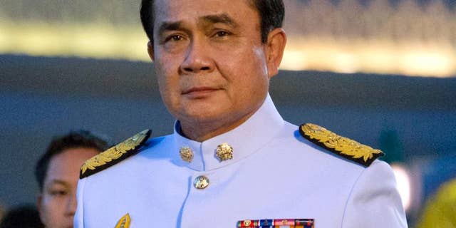 FILE - In this Sept. 4, 2014 file photo, Thailand's Prime Minister Gen. Prayuth Chan-ocha arrives at the government house in Bangkok, Thailand. Thailand's appointed Prime Minister Prayuth makes his first official overseas trip Thursday, Oct. 9, 2014 since seizing power in a military coup. (AP Photo/Sakchai Lalit, File)