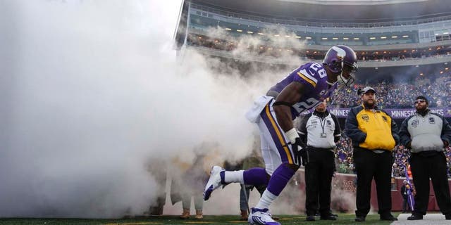 Sunday, Nov. 22: Minnesota Vikings running back Adrian Peterson comes onto the field out of a cloud of smoke to play the Green Bay Packers at TCF Bank Stadium in Minneapolis.