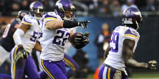 Sunday, November 16: Minnesota Vikings free safety Harrison Smith (center) intercepts a throw from Chicago Bears quarterback Jay Cutler (not pictured) in the second half of their game at Soldier Field. The Bears won 21-13.