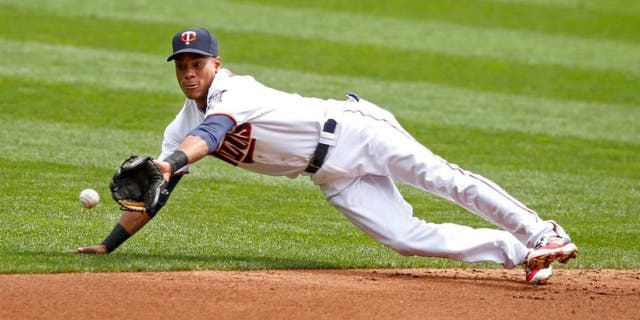 Thursday, Aug. 25, 2016: Minnesota Twins shortstop Jorge Polanco dives for a single by Detroit Tigers catcher James McCann (not pictured) in the second inning at Target Field. The Twins lost 8-5.