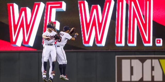 Friday, Aug. 28: Minnesota Twins left fielder Shane Robinson (left), center fielder Byron Buxton (back) and right fielder Eddie Rosario celebrate the 3-0 win over the Houston Astros at Target Field.