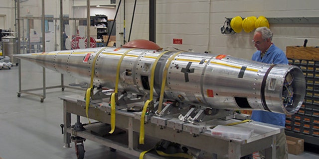 NASA technicians and engineers put the finishing touches on a unique experiment designed to demonstrate that an inflatable aeroshell/heat shield could be used to protect spacecraft when entering or leaving a planet's atmosphere.