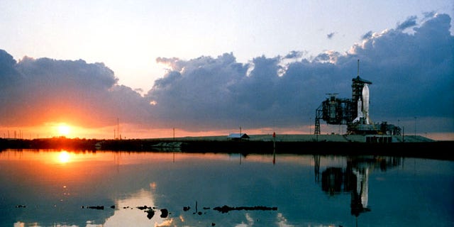 An early morning scene at the Kennedy Space Center's Launch Complex 39, with the space shuttle Columbia in position on Pad 39A at right in March 1981. The shuttle launched into space on April 12, 1981.