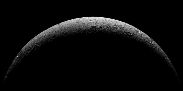 NASA's Cassini spacecraft captured this parting view showing the rough and icy crescent of Saturn's moon Dione following the spacecraft's last close flyby of the moon on Aug. 17, 2015.