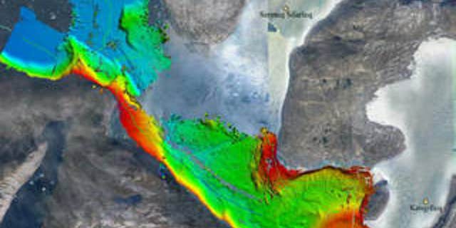 Seafloor depths on Greenland's west coast, measured by sonar aboard a research ship as part of the OMG project. Red and yellow are shallower areas, greens and blues deeper. The thin green line is the ship's path. The data give a better idea of where warm ocean water can reach glaciers.
