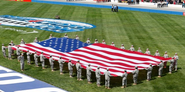FONTANA, CA - MARCH 22: A view of the American flag during the National Anthem prior to the NASCAR Sprint Cup Series Auto Club 400 at Auto Club Speedway on March 22, 2015 in Fontana, California. (Photo by Todd Warshaw/NASCAR via Getty Images)