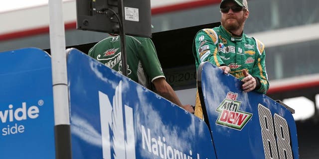 BRISTOL, TN - APRIL 17: Dale Earnhardt Jr., driver of the #88 Mountain Dew Dewshine Chevrolet, stands on top of his hauler prior to qualifying for the NASCAR Sprint Cup Series Food City 500 at Bristol Motor Speedway on April 17, 2015 in Bristol, Tennessee. (Photo by Mike Ehrmann/Getty Images)