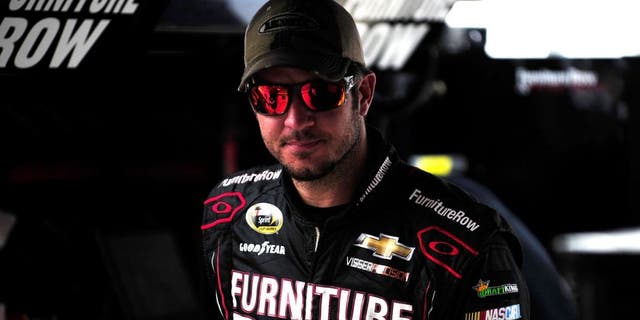 BRISTOL, TN - AUGUST 21: Martin Truex Jr., driver of the #78 Furniture Row/Visser Precision Chevrolet, stands in the garage area during practice for the NASCAR Sprint Cup Series Irwin Tools Night Race at Bristol Motor Speedway on August 21, 2015 in Bristol, Tennessee. (Photo by Jeff Curry/NASCAR via Getty Images)