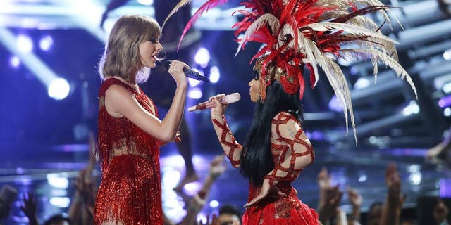 LOS ANGELES, CA - AUGUST 30: Taylor Swift (L) and Nicki Minaj perform onstage during the 2015 MTV Video Music Awards held at Microsoft Theater on August 30, 2015 in Los Angeles, California. (Photo by Michael Tran/FilmMagic)